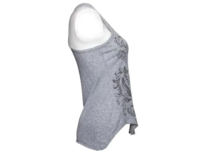 Alexander McQueen, Camiseta de tirantes gris con estampado de calaveras. 