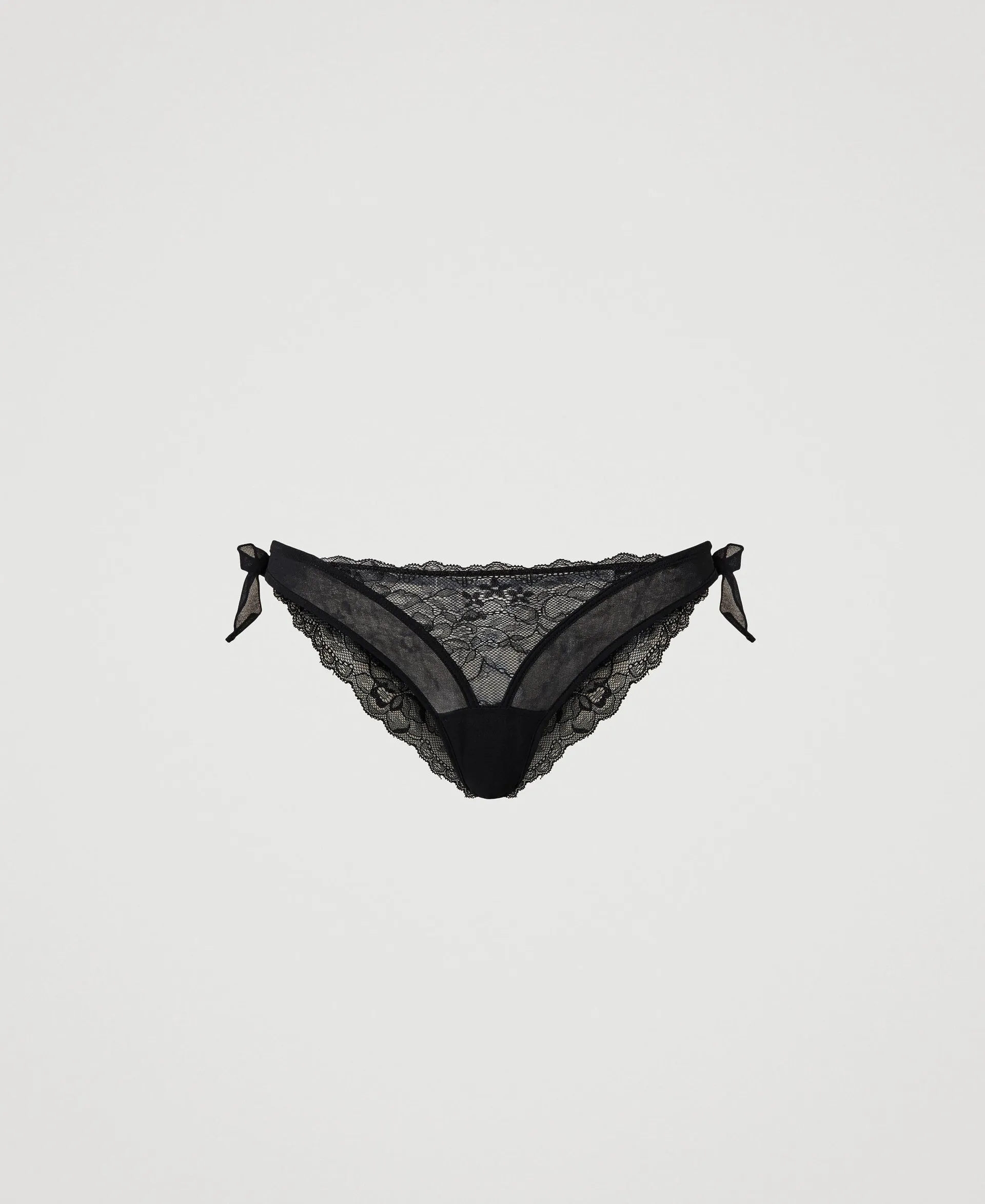 Slip brésilien en dentelle rebrodée avec nouettes